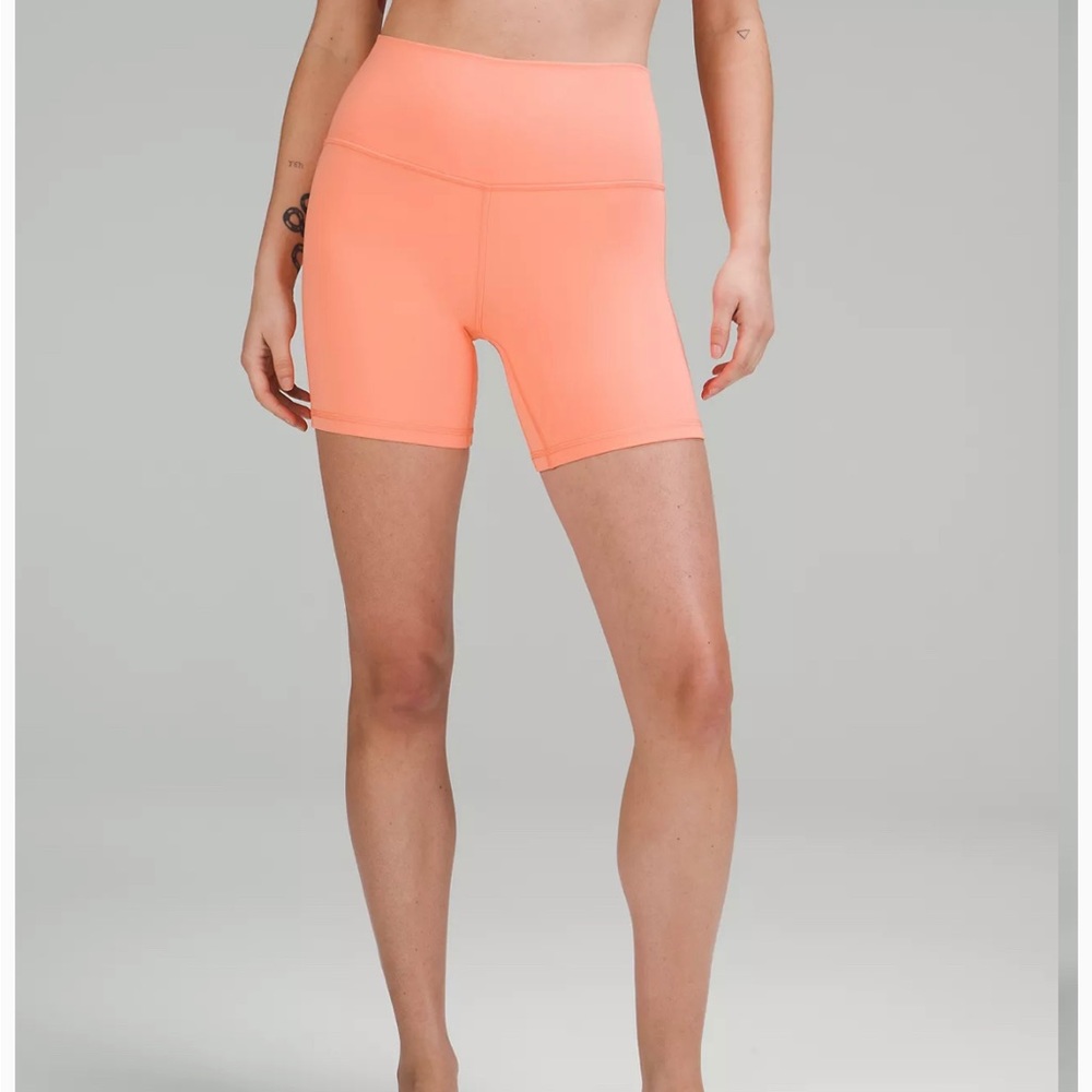 peachy/pink lululemon biker shorts